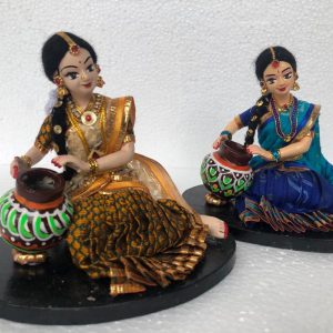 Girl Sitting With The Matki