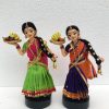 Girls holding plate of fruits-2