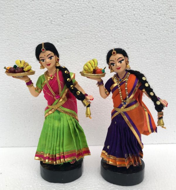 Girls holding plate of fruits-2